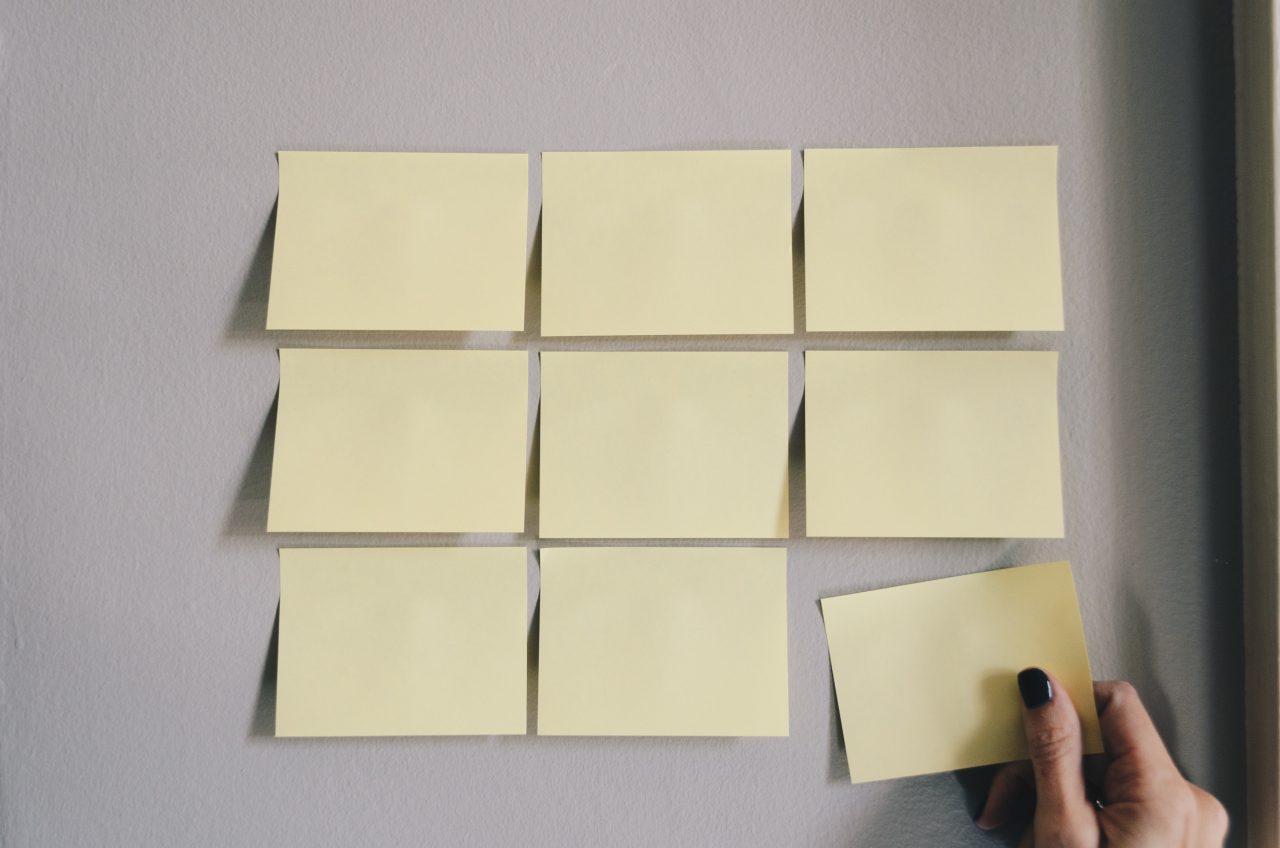 Nine post-its stuck to a wall