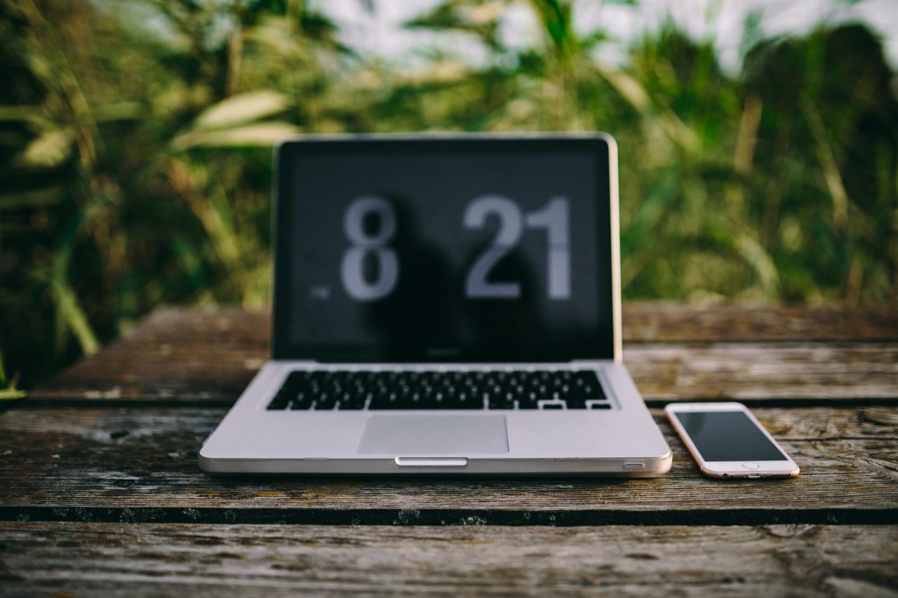 A laptop on an outdoor table